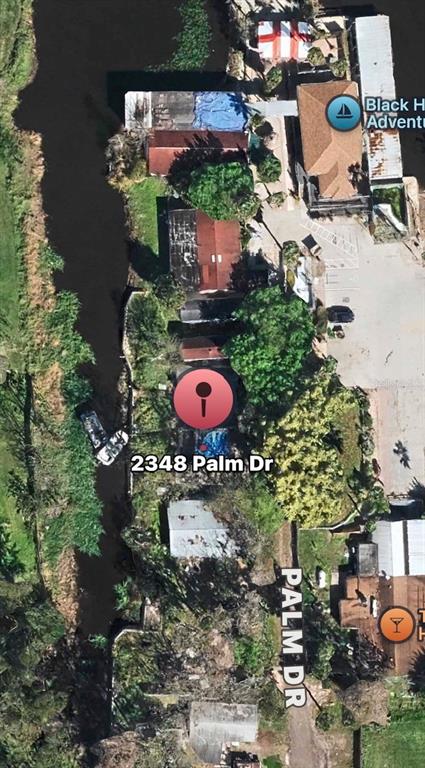 This is an aerial map view showing a property located along a narrow canal — 2348 PALM DRIVE, OVIEDO, FL