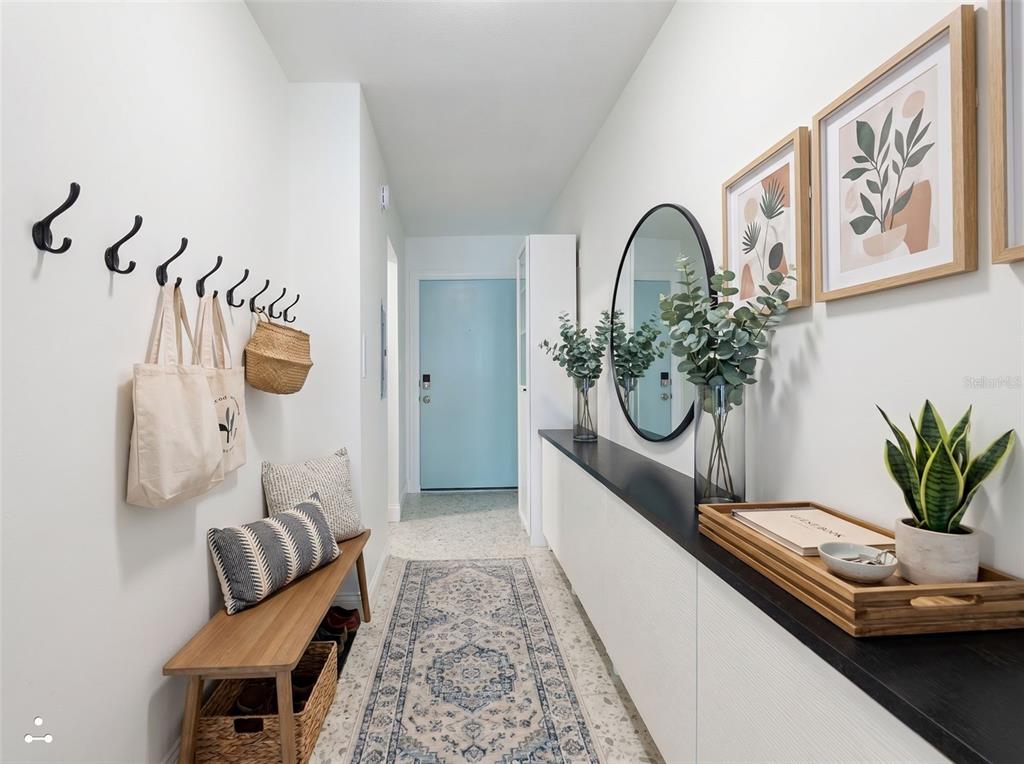 A living room with a sectional sofa, coffee table, and open kitchen with a breakfast bar — 3700 S ATLANTIC AVENUE UNIT 207, NEW SMYRNA BEACH, FL