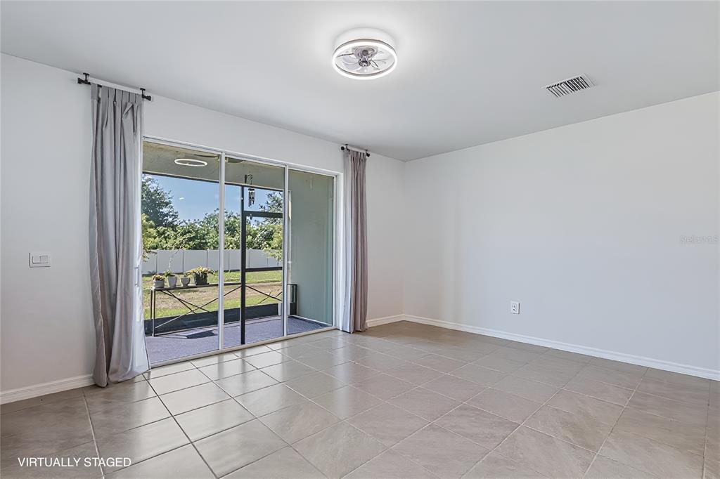 A dining room features a marble-topped table, modern chandelier, and a rectangular wall mirror — 388 MANGROVE SHADE CIRCLE, APOLLO BEACH, FL