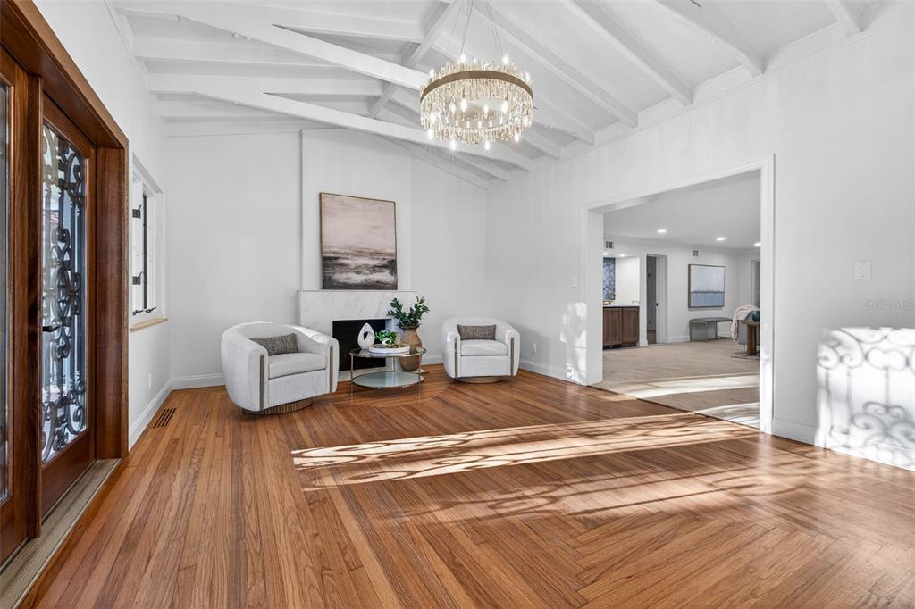 A brick patio sits in front of a white house with a red tile roof — 1222 BRIGHTWATERS BOULEVARD NE, ST PETERSBURG, FL