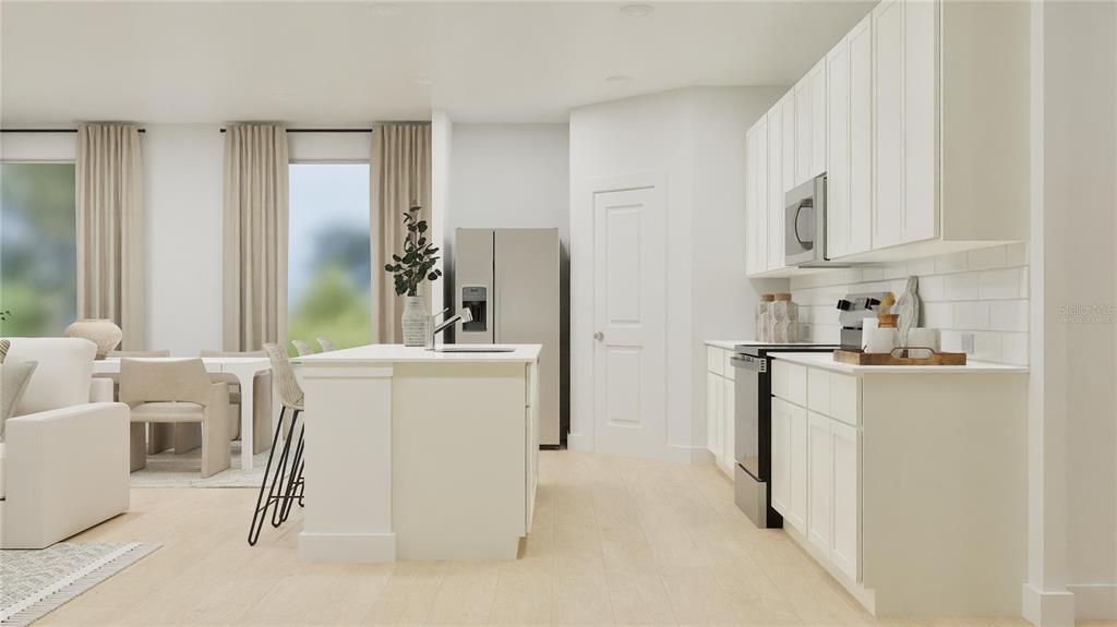 This is a digital rendering of a modern kitchen with white cabinets and a center island — 3058 GRANITE RIDGE AVENUE, MINNEOLA, FL