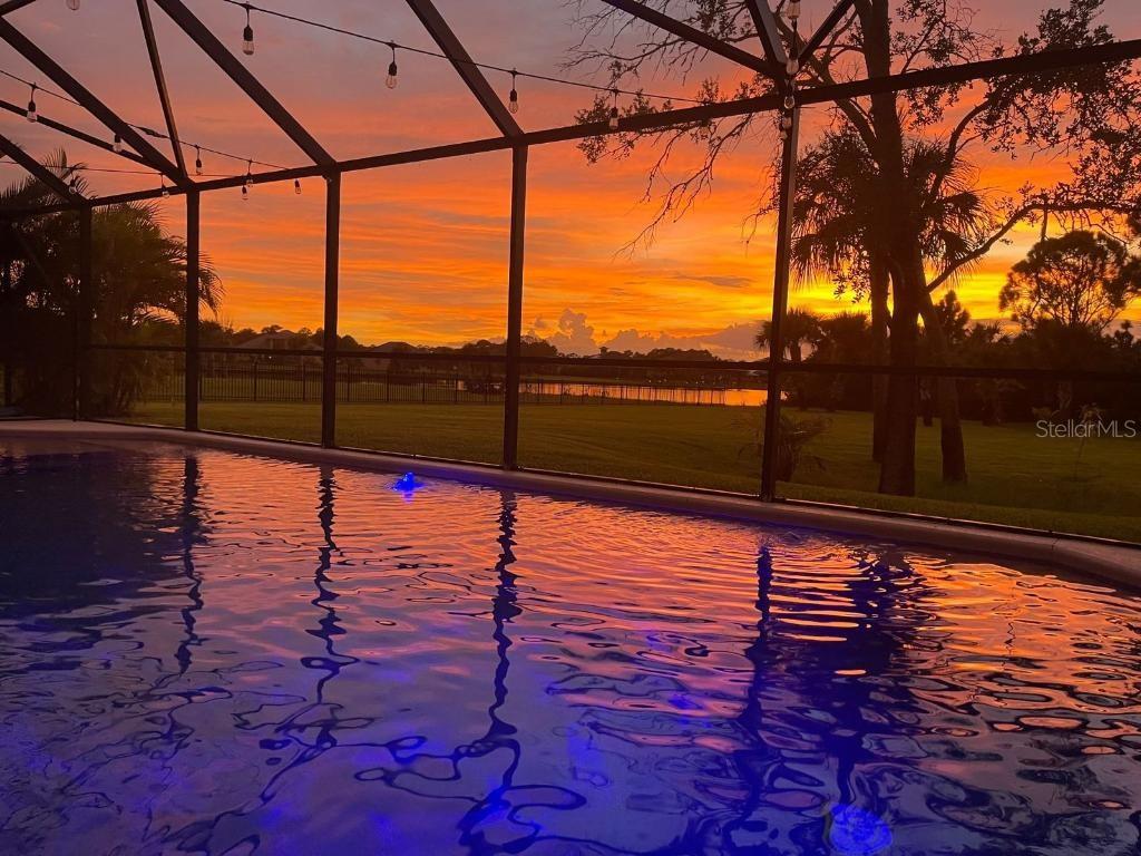 A two-story stucco house with a tile roof, solar panels, and a two-car garage — 3897 PROVINCE DRIVE, MELBOURNE, FL