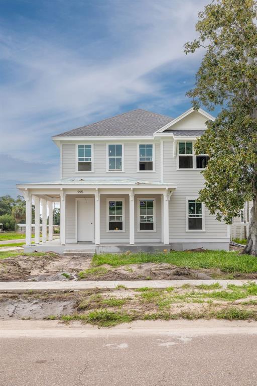 A two-story house with light gray siding and a front porch under construction — 995 48TH AVENUE N, ST PETERSBURG, FL