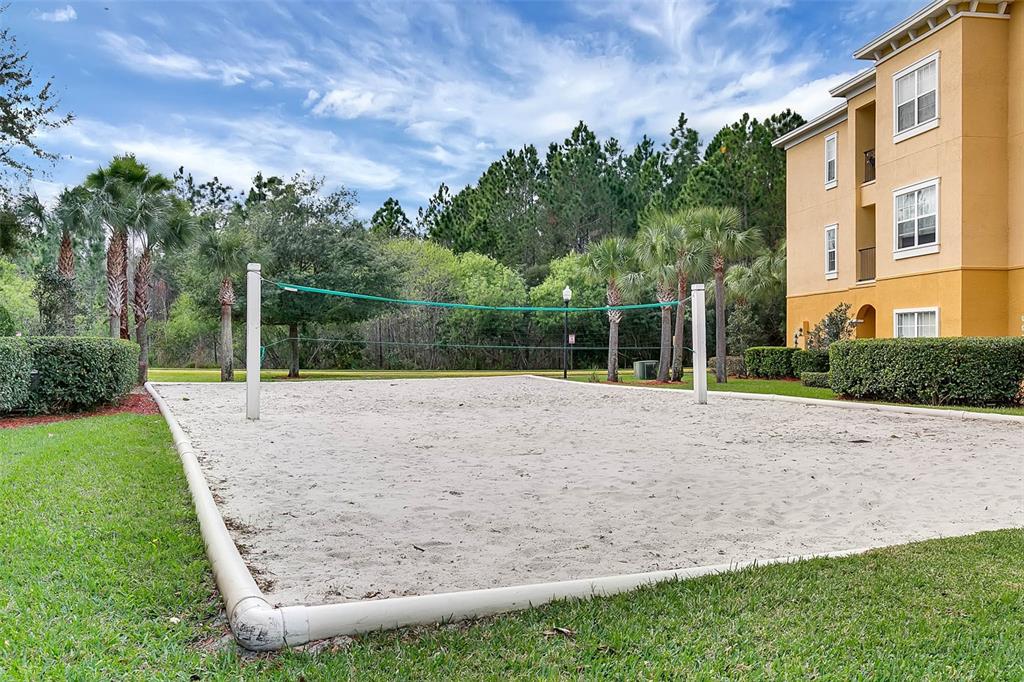 An empty room features wood-look flooring, light gray walls, a ceiling fan, and three windows — 3615 CONROY ROAD UNIT 627, ORLANDO, FL
