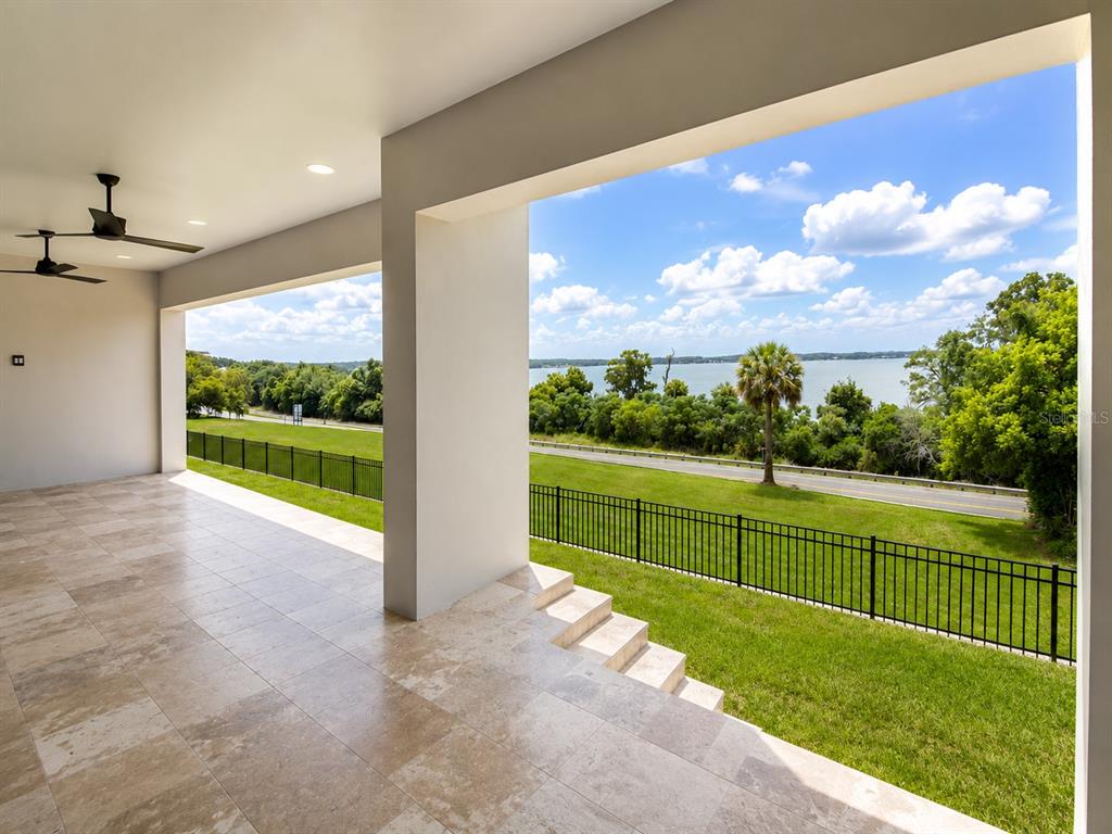 This is a floor plan for a single-story house with three suites and a garage — 594 CASEY LOOP, MOUNT DORA, FL