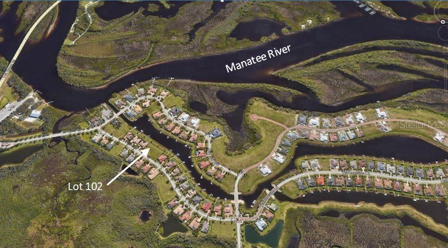 An aerial view shows a residential neighborhood with a labeled lot along the Manatee River — 11815 RIVER SHORES TRAIL, PARRISH, FL