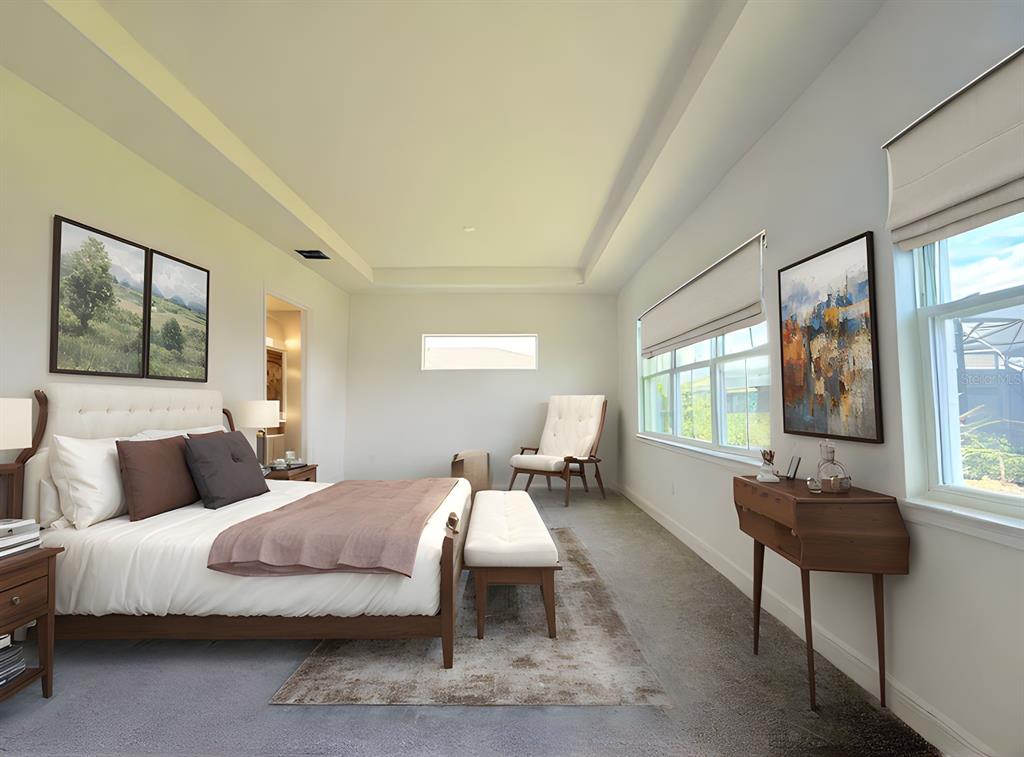 A bedroom features a tray ceiling, a bed with brown accents, and a wooden console table — 5019 DANCY LANE, ST CLOUD, FL