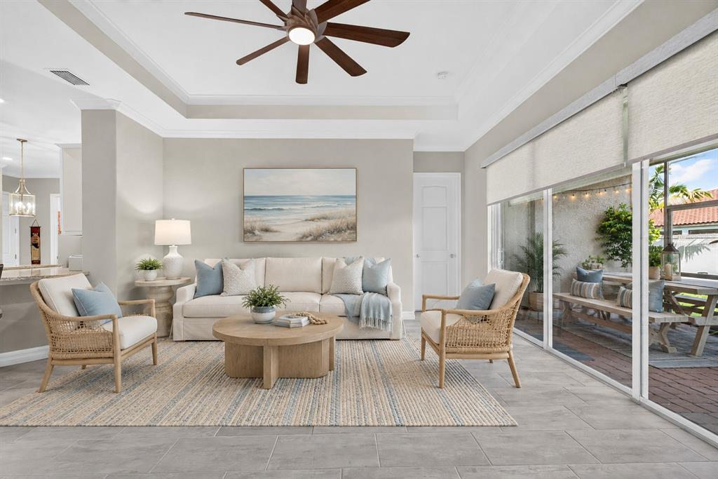 A single-story house with a stone facade, a tiled roof, and a paved driveway — 11825 PERENNIAL PLACE, BRADENTON, FL