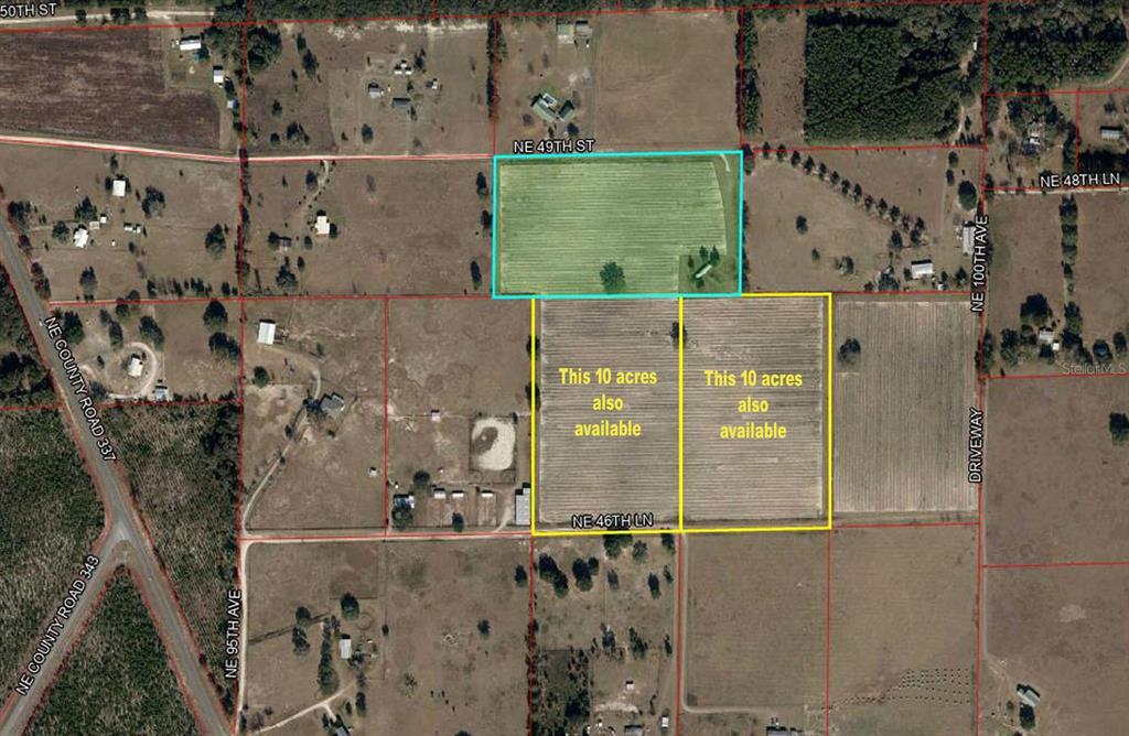 This is an aerial map showing three adjacent parcels of land outlined in colored borders — 9750 NE 49TH STREET, BRONSON, FL