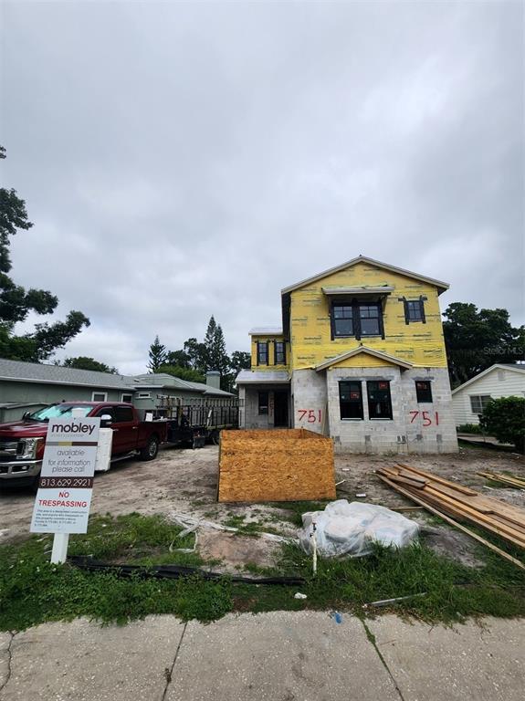 This is a two-story floor plan showing a garage, living areas, and multiple bedrooms — 751 40TH AVENUE N, ST PETERSBURG, FL