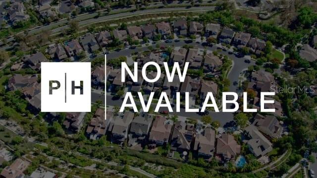 This is an aerial view of a suburban residential neighborhood with houses and winding streets — 8159 ROLL TIDE TERRACE, PARRISH, FL