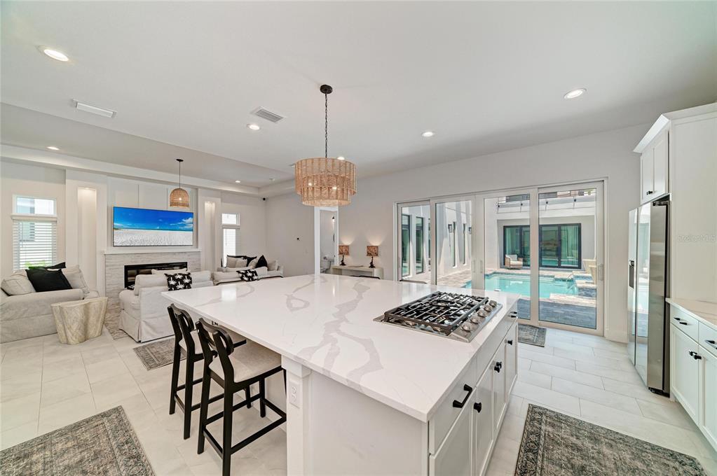 An aerial view shows a two-story residential home with a private pool and courtyard — 5935 CAT CLAW LANE, BRADENTON, FL