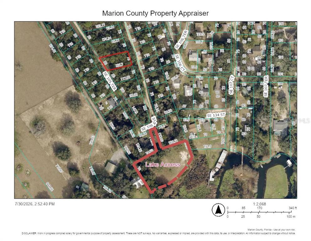 This is a property map showing two highlighted parcels of land with lake access — 00 SE 105TH TERRACE, OCKLAWAHA, FL