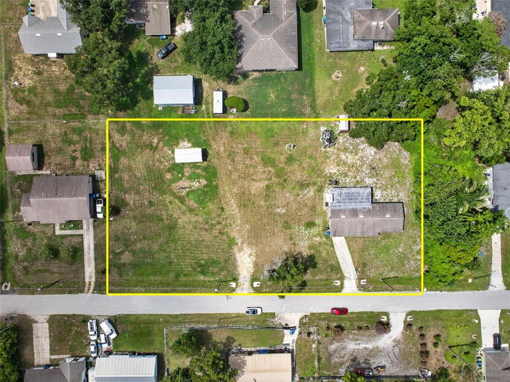 An aerial view shows a rectangular lot with a house, shed, and driveway — 212 15TH AVENUE, OCOEE, FL