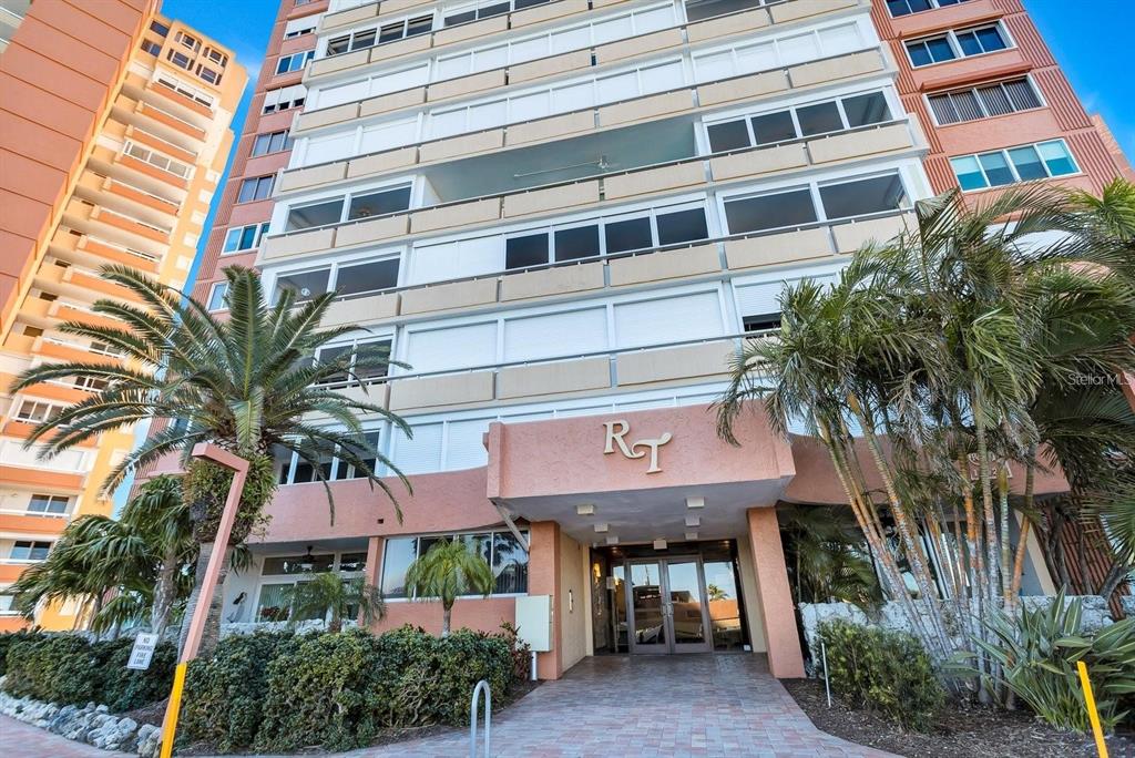 A tall, multi-story residential apartment building with balconies and a brown exterior facade — 17920 GULF BOULEVARD UNIT 1203, ST PETERSBURG, FL