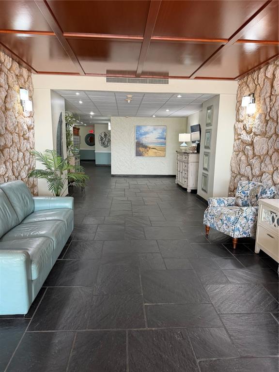 An elevated view of a swimming pool next to a beach and a tall building — 17920 GULF BOULEVARD UNIT 1203, ST PETERSBURG, FL