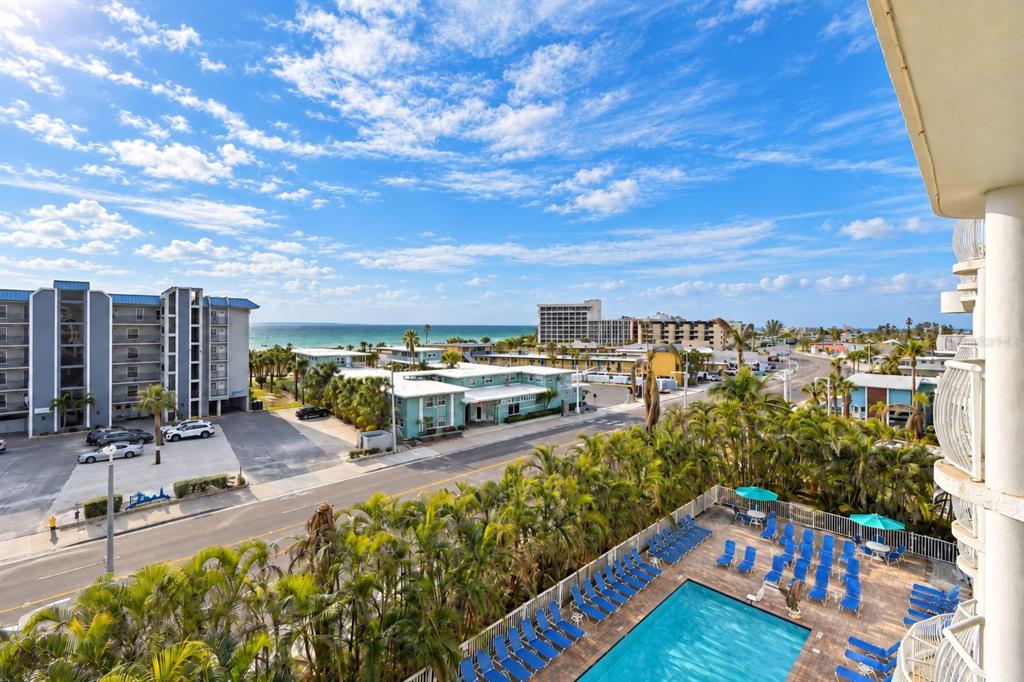 An aerial view of a white sand beach with dunes and the ocean — 11605 GULF BOULEVARD UNIT 502, TREASURE ISLAND, FL