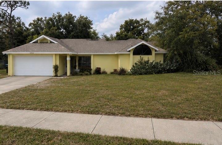 A covered patio with a brick floor overlooks a screened-in swimming pool and spa — 3208 LAKE HELEN OSTEEN ROAD, DELTONA, FL