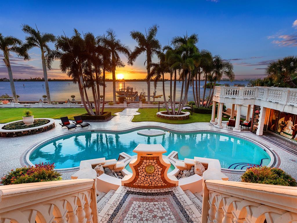 A large Mediterranean-style mansion with a multi-level terrace, stone exterior, and a swimming pool — 1310 S LAKE SHORE DRIVE, SARASOTA, FL
