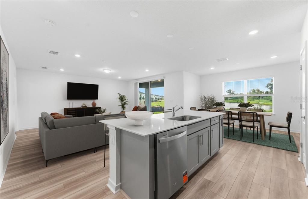 This image displays a design board for a home interior package featuring neutral-toned finishes — 9885 TRELLIS VINE WAY, PARRISH, FL