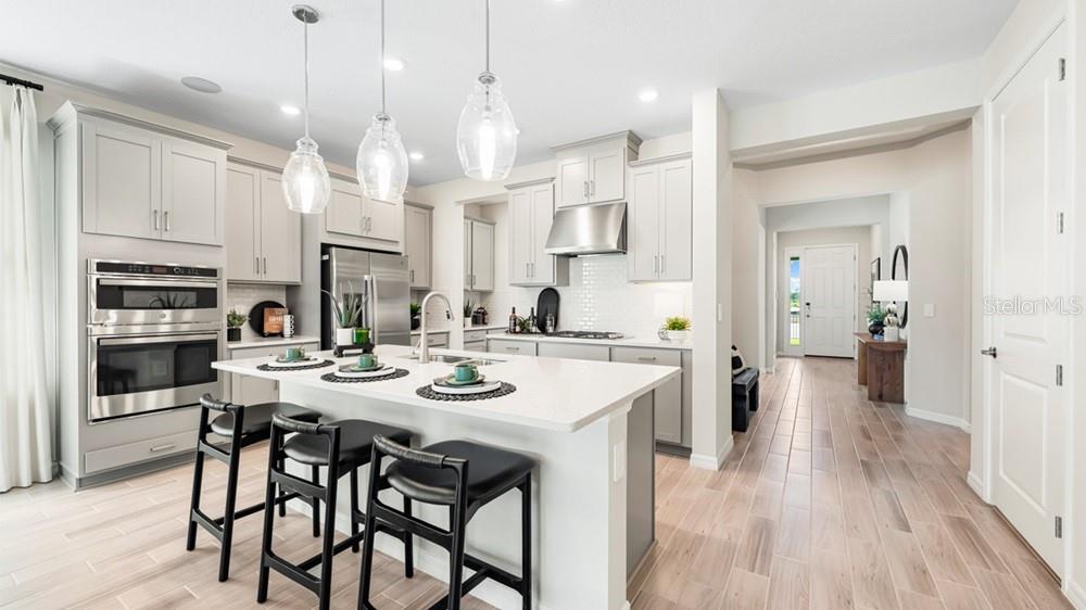 This is a floor plan for a four-bedroom home with a two-car garage and lanai — 13610 CORNERSTONE WAY, PARRISH, FL