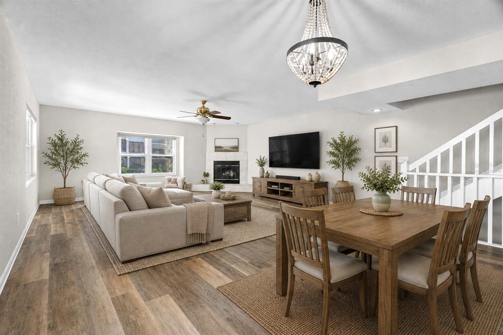 A staircase with white railings leads upward in a room with wood-look flooring — 545 PINELLAS BAYWAY S UNIT 207, TIERRA VERDE, FL