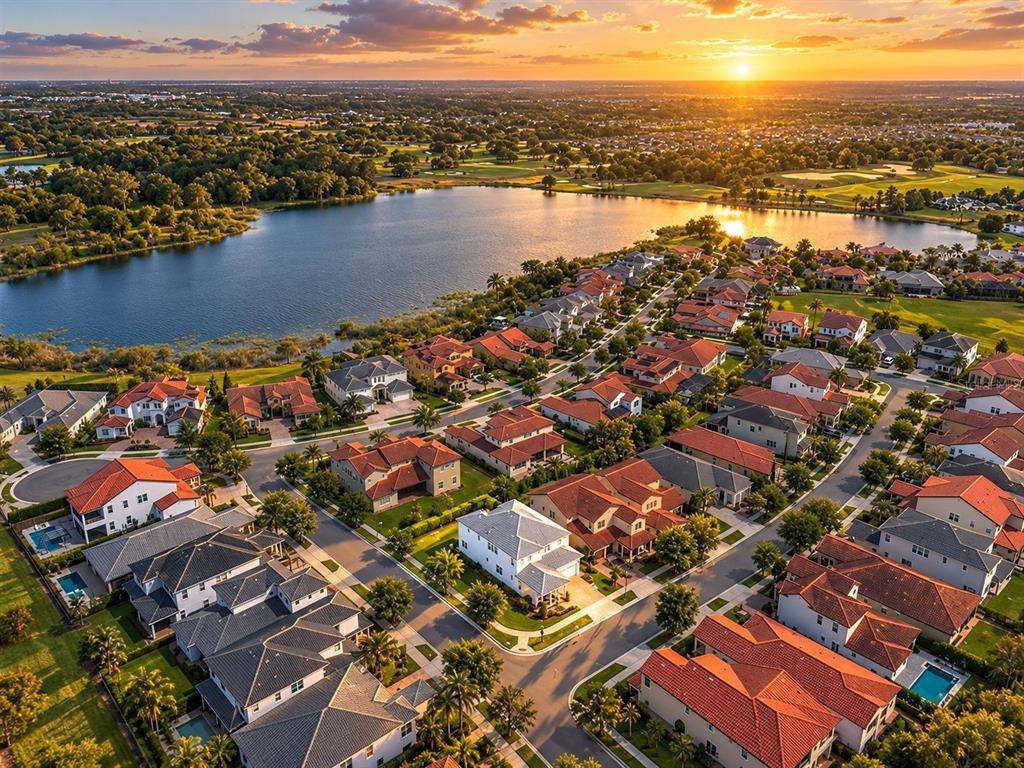 An aerial view shows a two-story house with a gray roof and backyard patio — 15161 CANOE PLACE, WINTER GARDEN, FL