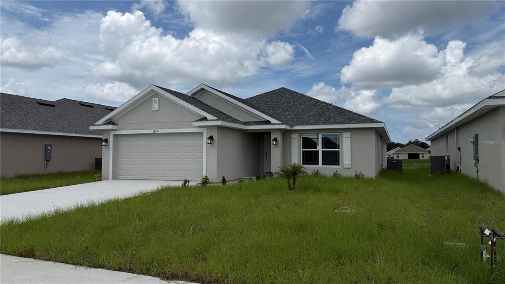 A view of a pond with a row of suburban houses in the background — 2679 AVERLAND LOOP, NORTH PORT, FL