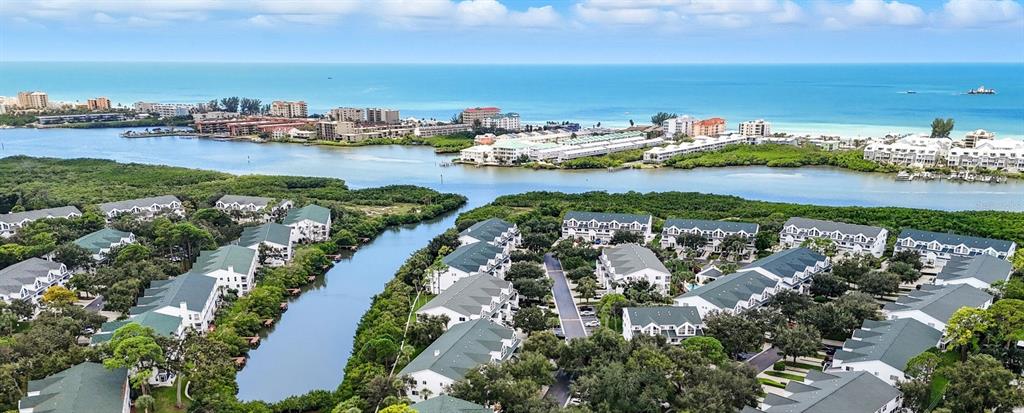 This floor plan shows three levels of a townhouse with bedrooms, bathrooms, and balconies — 14879 SEMINOLE TRAIL, SEMINOLE, FL