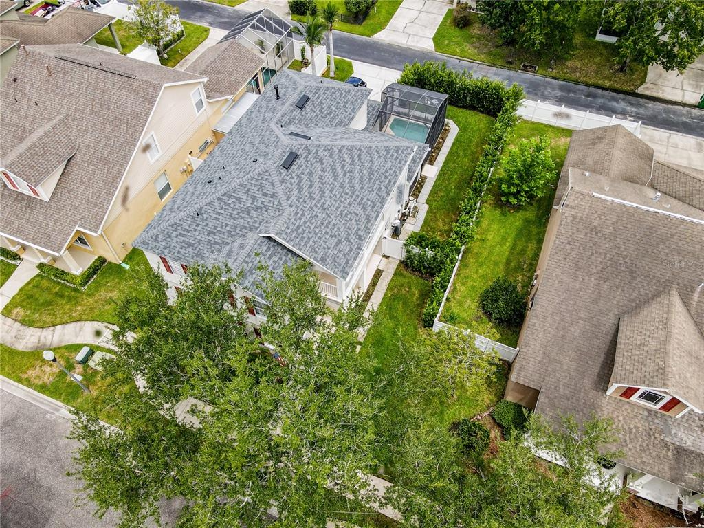 An aerial view shows a two-story house with a screened-in pool and a blue SUV — 644 AUTUMN OAKS LOOP, WINTER GARDEN, FL