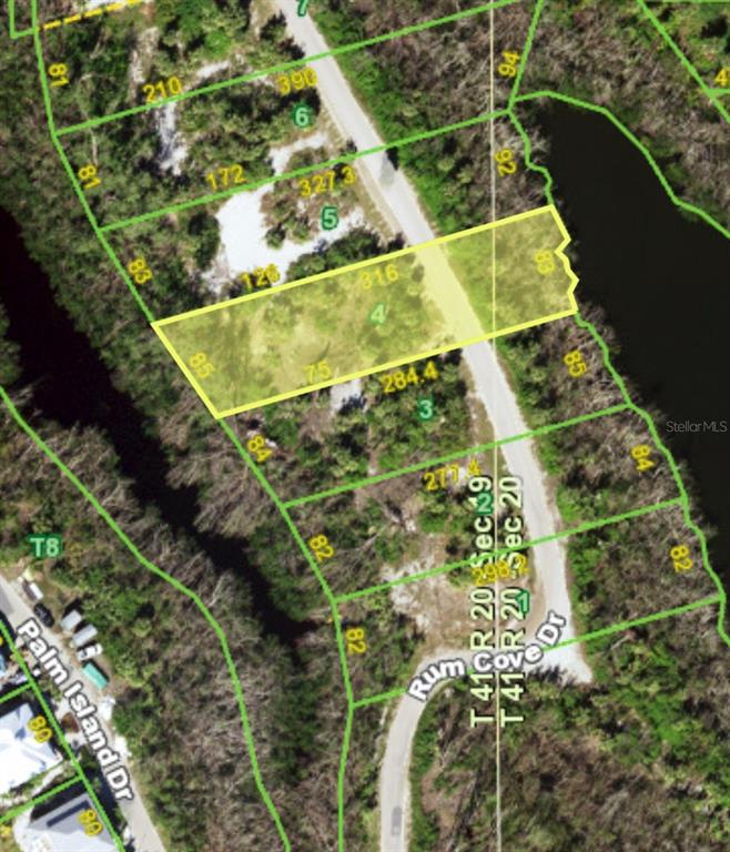 This is an aerial map showing a highlighted parcel of land along a road — 6150 RUM COVE DRIVE, PLACIDA, FL