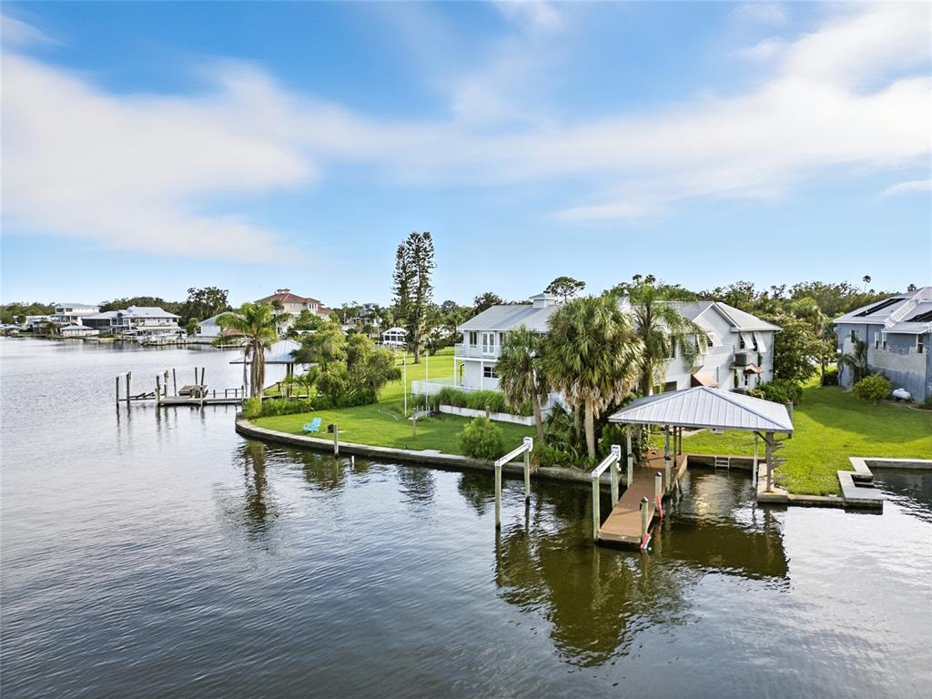 An aerial view of a waterfront house with a private dock and boat lift — 2435 N WATERSEDGE DRIVE, CRYSTAL RIVER, FL