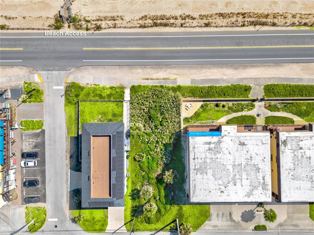 An aerial view shows a beach access road, parking area, and two adjacent buildings — 21XX N OCEAN SHORE BOULEVARD, FLAGLER BEACH, FL