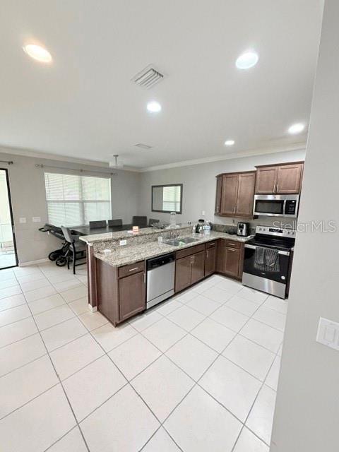 A bathroom features a walk-in shower, a soaking tub, and dual vanities with granite countertops — 1743 PORTOFINO MEADOWS BOULEVARD, ORLANDO, FL