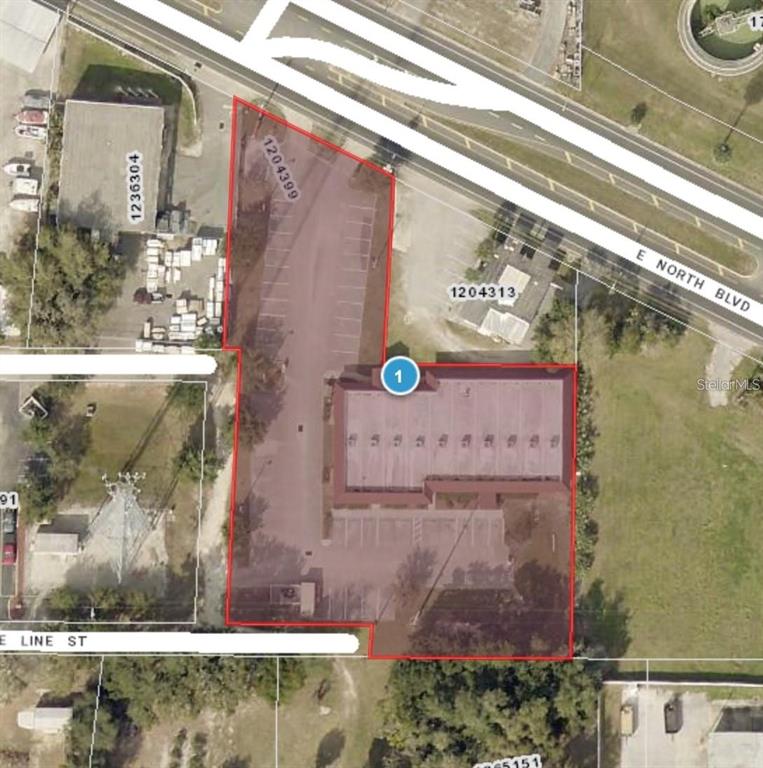 This aerial map shows a commercial property with a building and parking lot — 401 E NORTH BOULEVARD UNIT 101/103, LEESBURG, FL