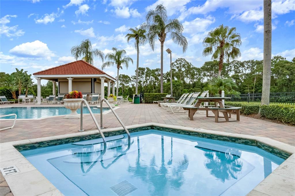 A white front door with a side window opens into a room with a game table — 2721 LIDO KEY DRIVE, KISSIMMEE, FL