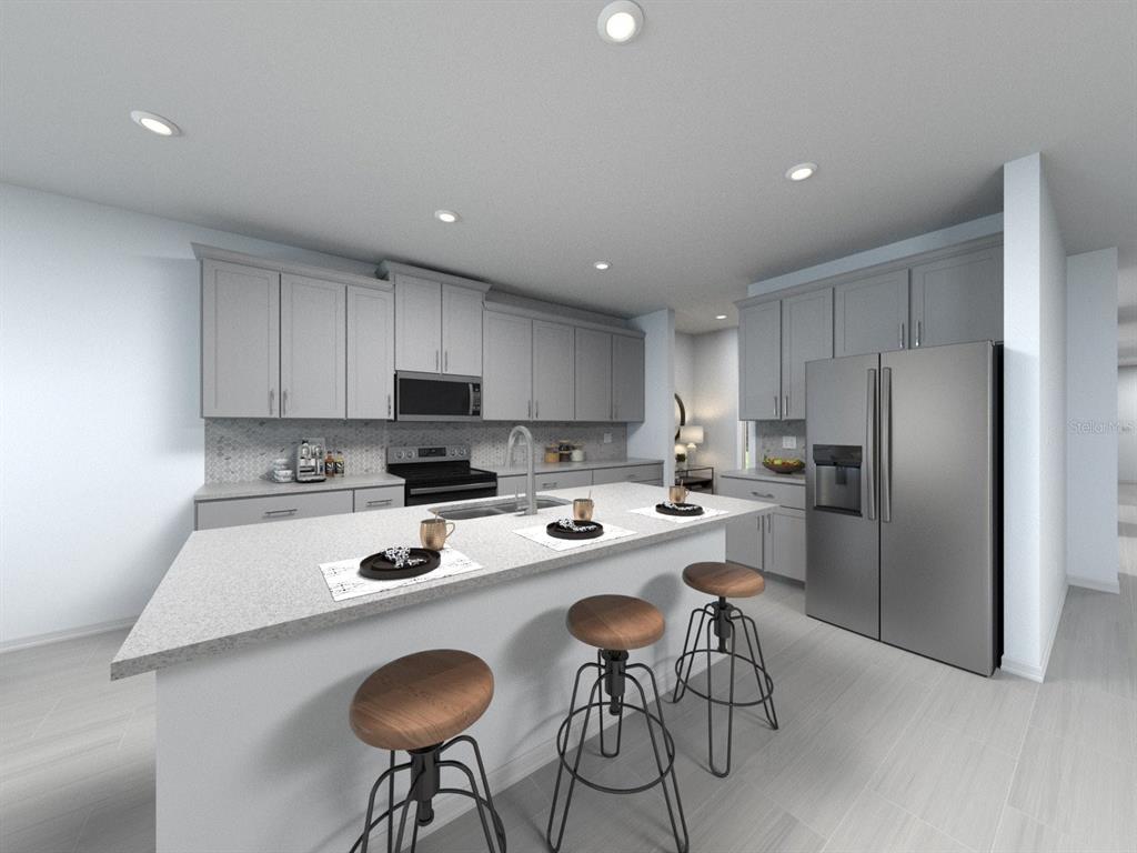 This is a digital rendering of a modern kitchen featuring gray cabinetry and a central island — 3429 ORCHARD LOOP, BARTOW, FL