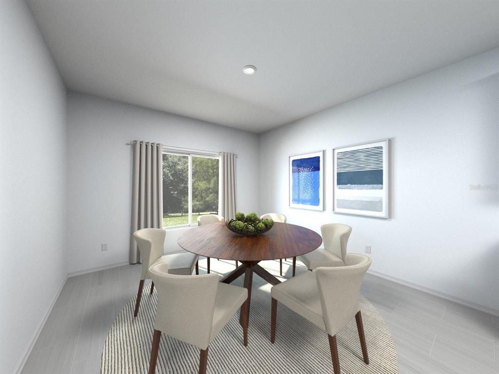 This is a digital rendering of a dining room with a round table and chairs — 3429 ORCHARD LOOP, BARTOW, FL