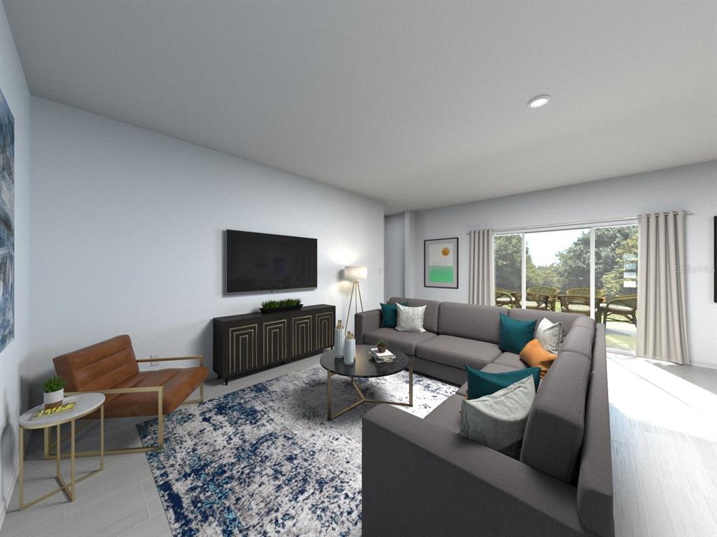 This is a digital rendering of a living room featuring a sectional sofa and television — 3429 ORCHARD LOOP, BARTOW, FL