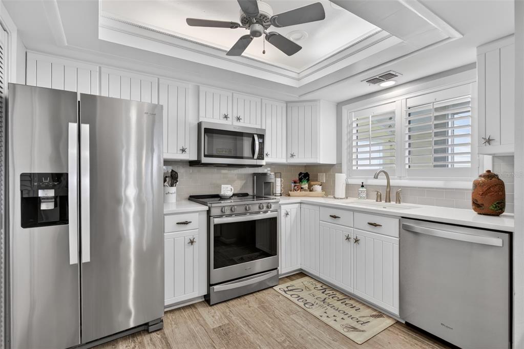 A view from an entryway looking into a living room with a loft ladder — 6300 A1A S UNIT B24U, ST AUGUSTINE, FL