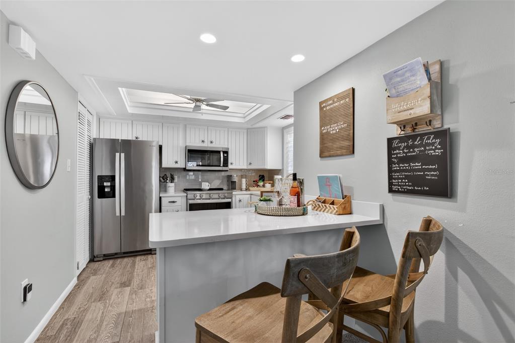 A hallway features a white door, a closet, a vent, and an adjacent bathroom entrance — 6300 A1A S UNIT B24U, ST AUGUSTINE, FL