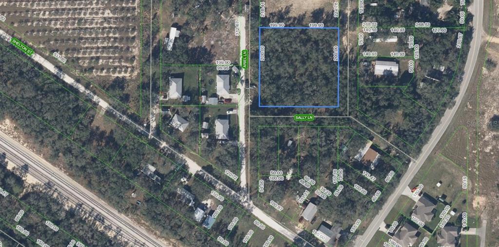This is an aerial map showing a rectangular plot of land highlighted in blue — 5118 WENDY LANE, SEBRING, FL