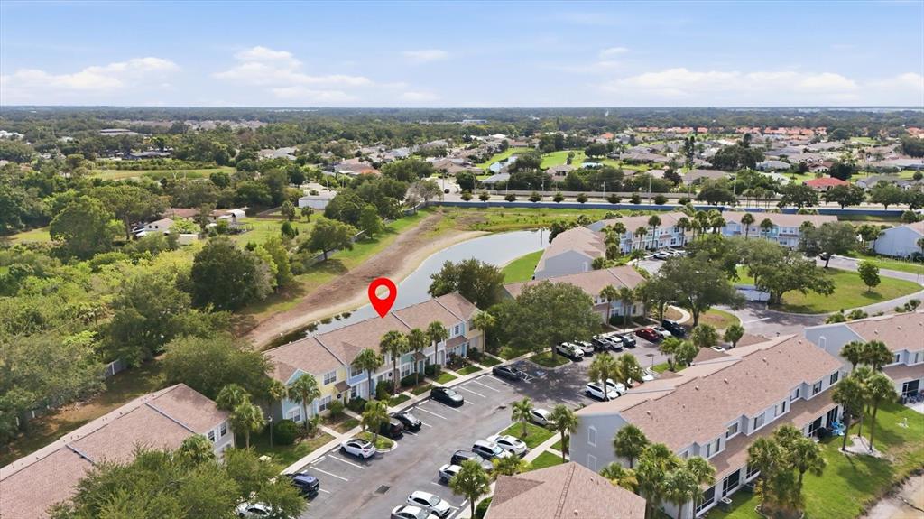 An aerial view shows a multi-unit residential building with a red location pin — 4642 SABAL KEY DRIVE, BRADENTON, FL
