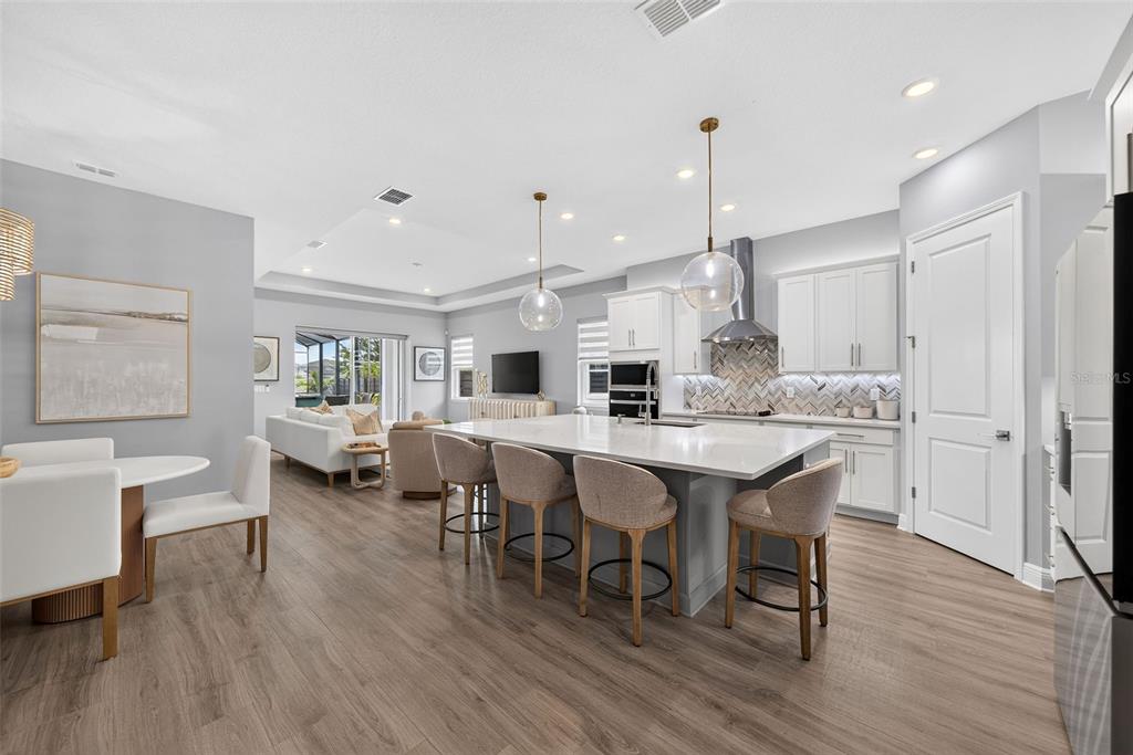 A two-story house with a two-car garage and a covered front porch at dusk — 13175 MCMILLAN, ORLANDO, FL