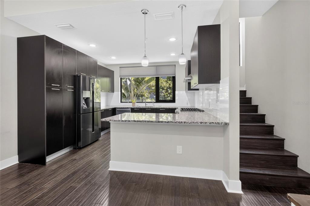 A rooftop patio features a hot tub with steps, a pergola, and outdoor furniture — 2511 N GRADY AVENUE UNIT 78, TAMPA, FL