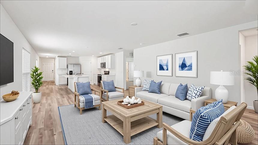 This is a rendering of an open-concept living room with a kitchen in the background — 2094 NE 33RD LANE, OCALA, FL