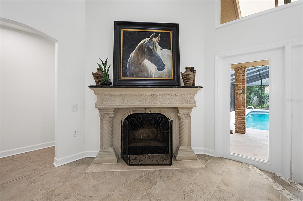 A two-story house with a beige exterior, a two-car garage, and a large grassy yard — 1 CROOKED BRIDGE WAY, ORMOND BEACH, FL