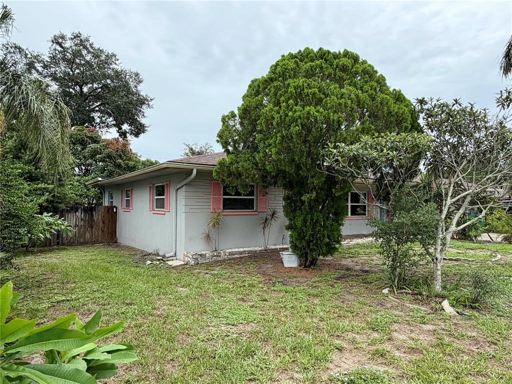 A single-story house with a brown roof, gray siding, and a two-car garage — 1513 S KEENE ROAD, CLEARWATER, FL