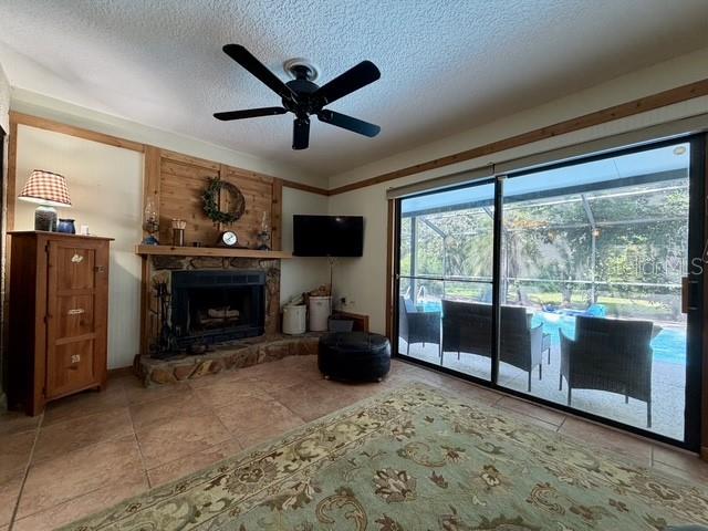 A dining room features a wooden table with chairs and a bench on a patterned rug — 155 WOODCUTTER LANE, PALM HARBOR, FL