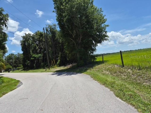 A scenic view of a clear, blue-tinted spring flowing under a bridge in Ocala National Forest — 69 SE, OCKLAWAHA, FL
